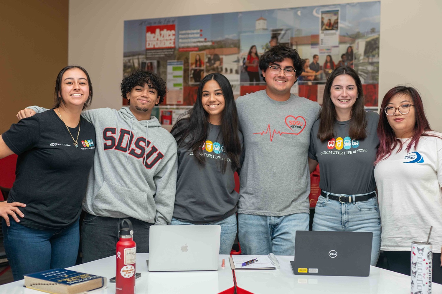 students standing around table